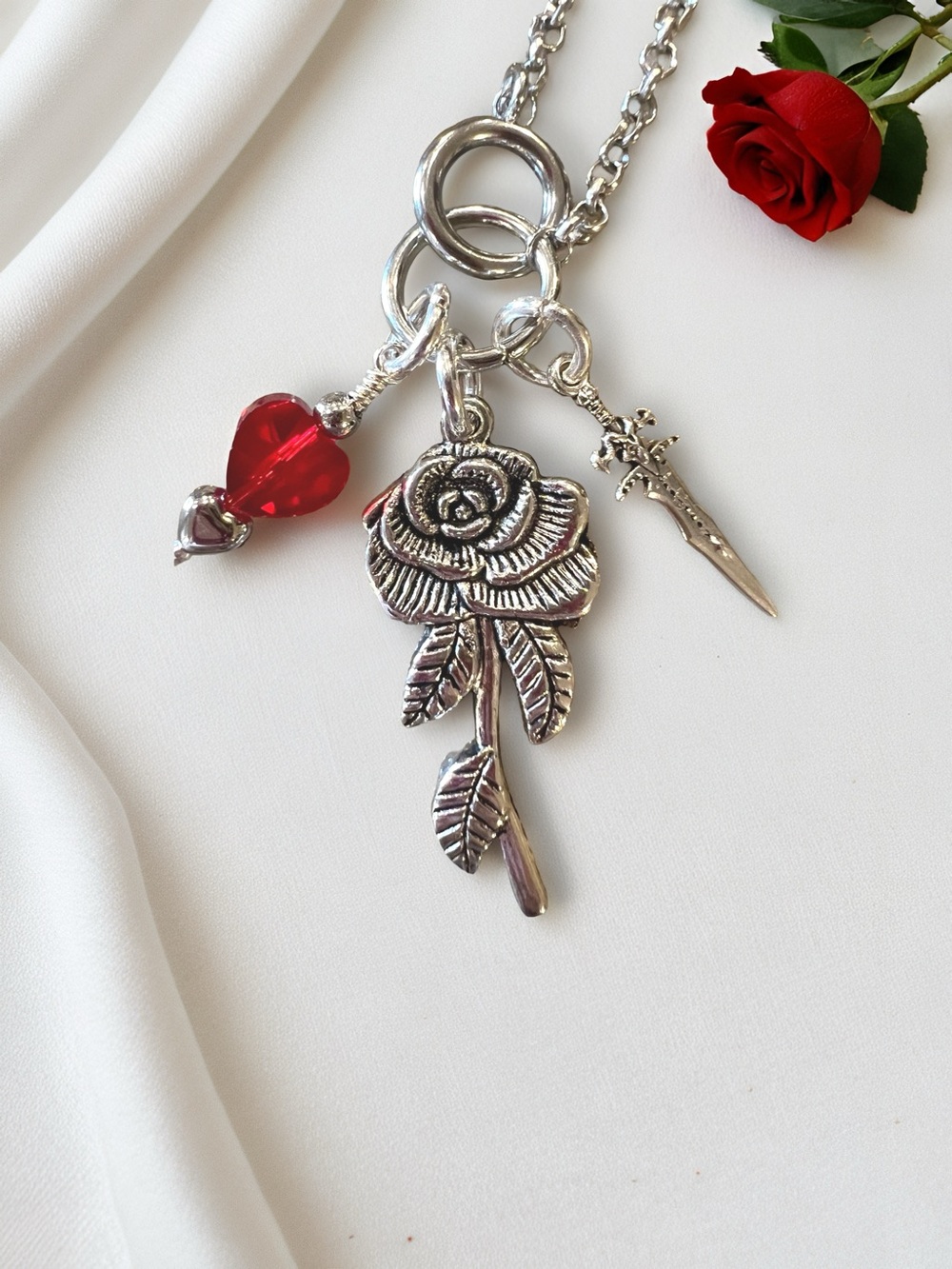 Dark Romantic Silver Rose and Dagger Pendants with Crystal Red Heart Accent